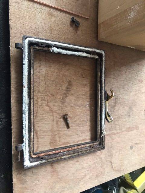 Woodburner Door Before in Carmarthen Workshop